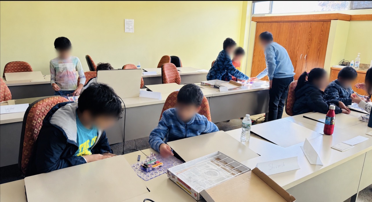 Students completing a hands-on STEM challenge